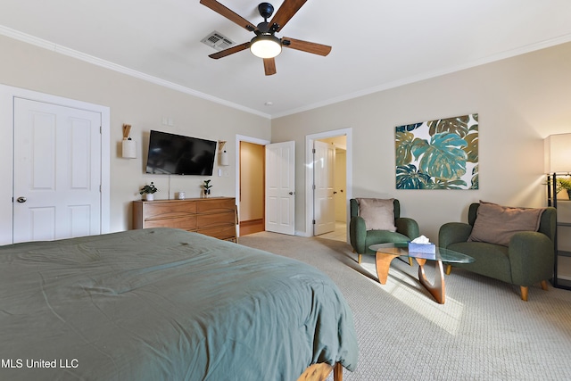 carpeted bedroom featuring ceiling fan and crown molding