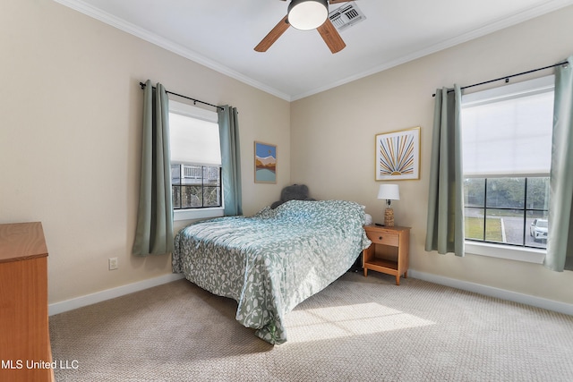 carpeted bedroom with ceiling fan, crown molding, and multiple windows