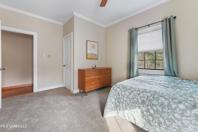 bedroom with carpet flooring, ceiling fan, and crown molding