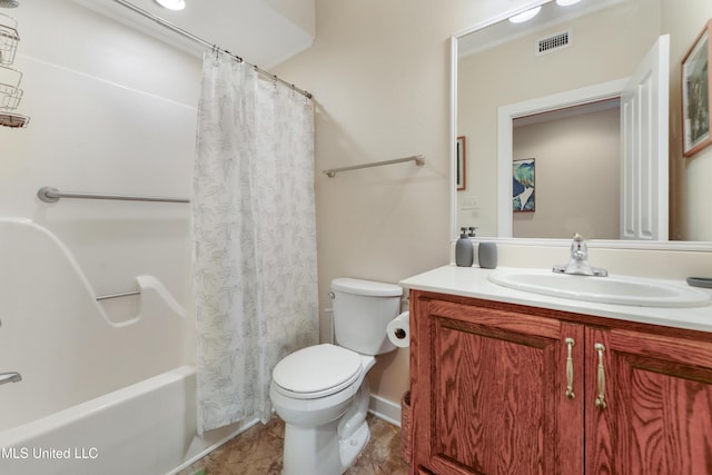 full bathroom with vanity, shower / bath combo, and toilet