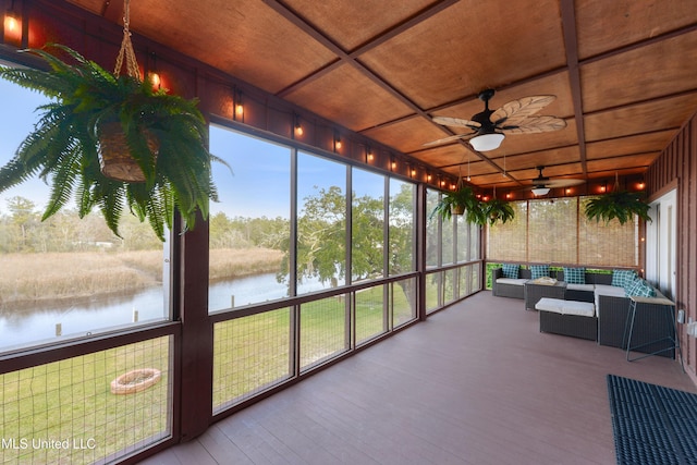 sunroom with ceiling fan, a water view, wood ceiling, and coffered ceiling