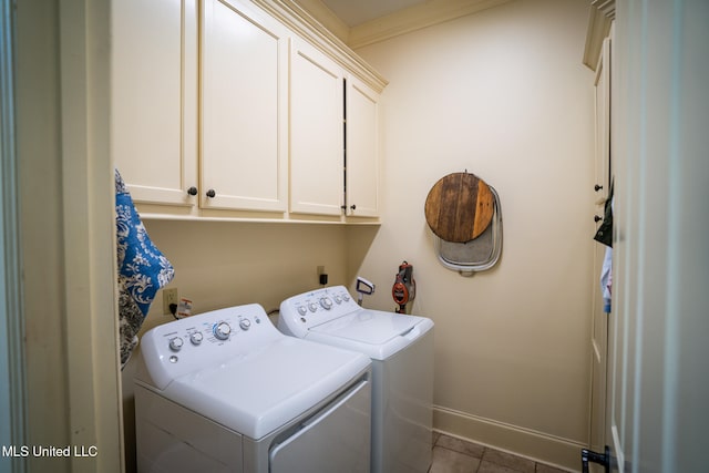 washroom featuring tile patterned floors, cabinets, separate washer and dryer, and crown molding