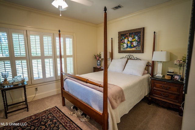 carpeted bedroom with ceiling fan and crown molding