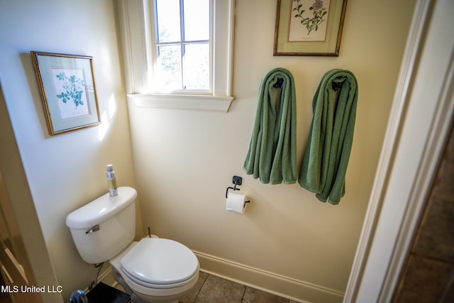 bathroom featuring tile patterned floors and toilet