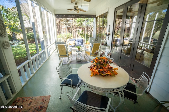 sunroom with a wealth of natural light and ceiling fan