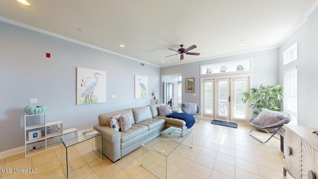 living room featuring light tile patterned floors, crown molding, and ceiling fan