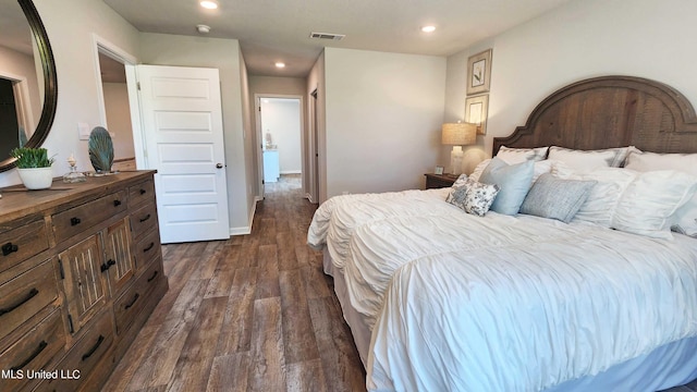 bedroom with recessed lighting, visible vents, baseboards, and dark wood-type flooring