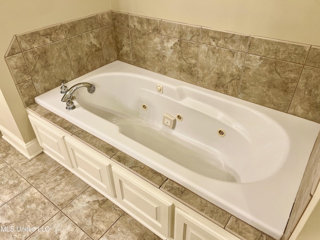 bathroom featuring a bathtub and tile patterned floors