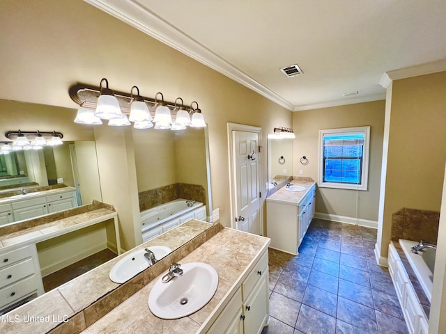 bathroom with tiled bath, vanity, crown molding, and tile patterned flooring