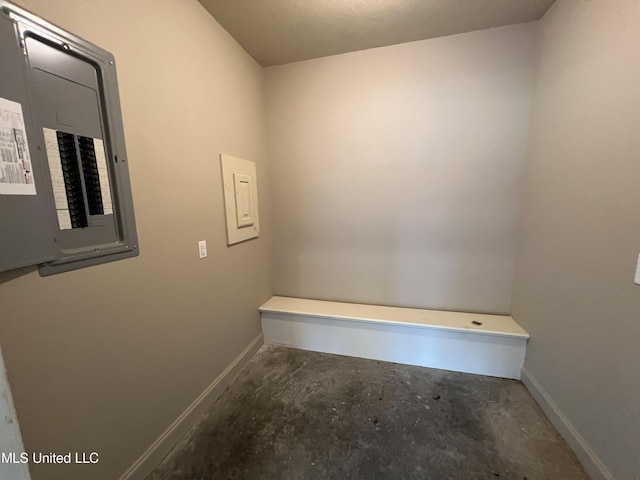 bathroom with concrete floors and electric panel