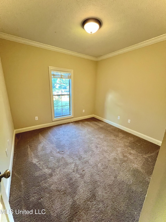 carpeted spare room featuring a textured ceiling and crown molding