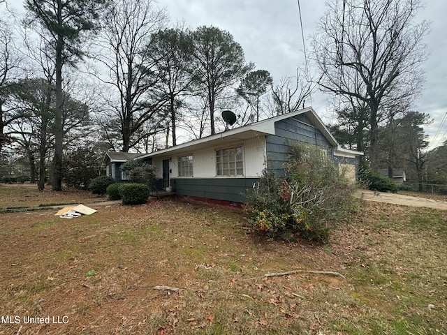 view of home's exterior with a yard