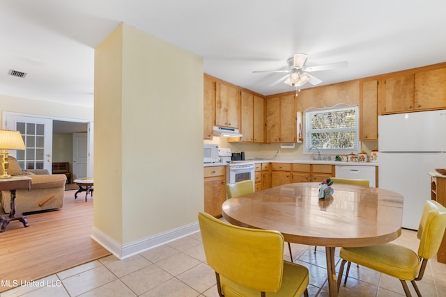 kitchen with ceiling fan, french doors, sink, white appliances, and light wood-type flooring