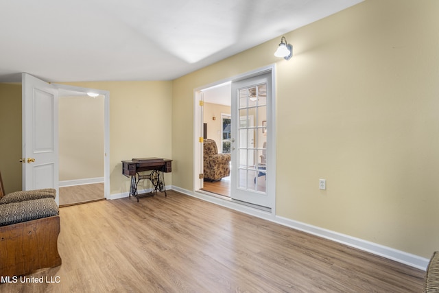 unfurnished room with light hardwood / wood-style flooring