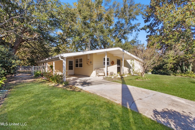 view of front of property with a front lawn and a carport