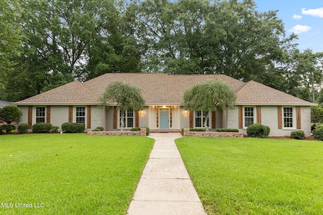 1304 Estelle St, Hattiesburg, MS 39402 - ranch-style home with brick siding, a front yard, and a shingled roof