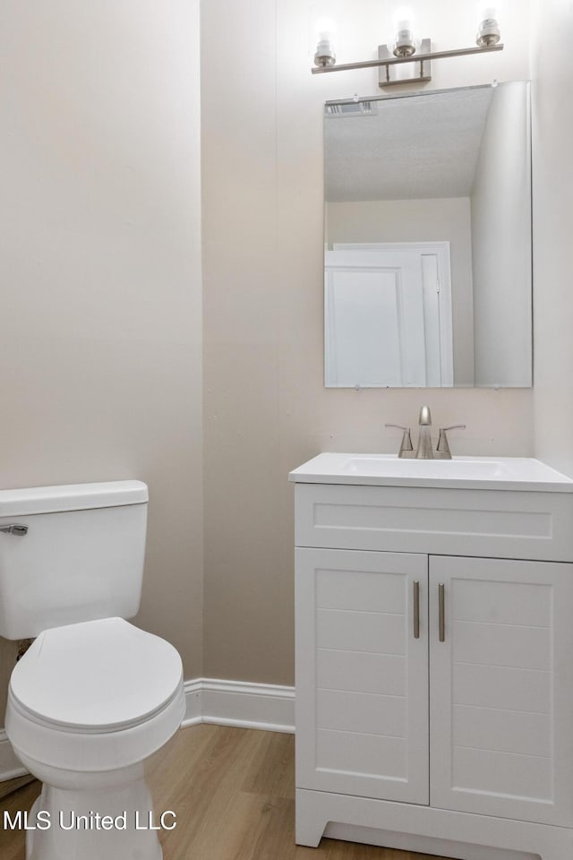1304 Estelle St, Hattiesburg, MS 39402 - half bath featuring vanity and wood finished floors