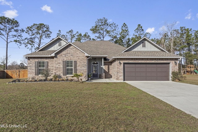 view of front facade with a garage and a front lawn