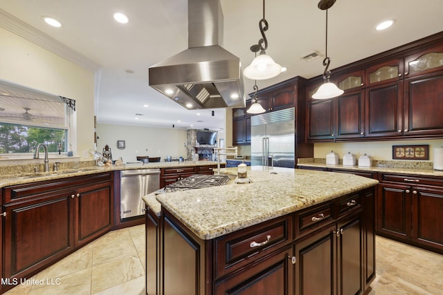 kitchen featuring a sink, appliances with stainless steel finishes, visible vents, a kitchen island, and island exhaust hood