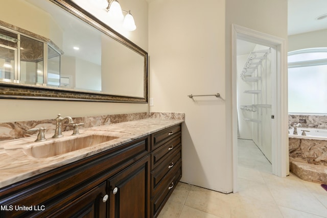 full bathroom featuring a garden tub, tile patterned floors, an enclosed shower, and vanity