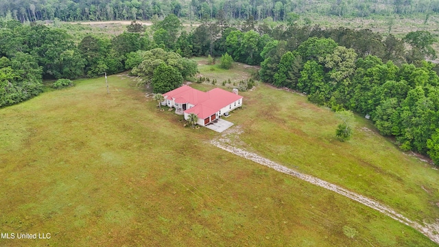 birds eye view of property featuring a view of trees