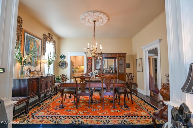 204 Arlington Ave, Natchez, MS 39120 - dining space featuring a chandelier, crown molding, and wood finished floors