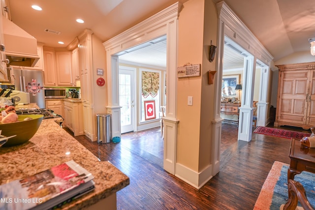 204 Arlington Ave, Natchez, MS 39120 - kitchen featuring stainless steel appliances, dark wood-type flooring, extractor fan, vaulted ceiling, and recessed lighting