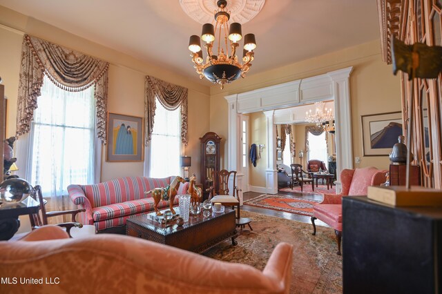 204 Arlington Ave, Natchez, MS 39120 - living area with a chandelier and plenty of natural light