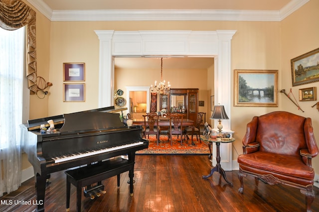 204 Arlington Ave, Natchez, MS 39120 - living area with a chandelier, dark wood-style flooring, and ornamental molding