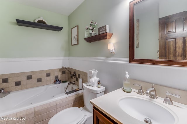 2213 N St, Gulfport, MS 39507 - full bathroom featuring vanity, a whirlpool tub, and toilet