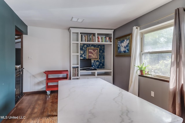 2213 N St, Gulfport, MS 39507 - bedroom with dark wood-type flooring and baseboards