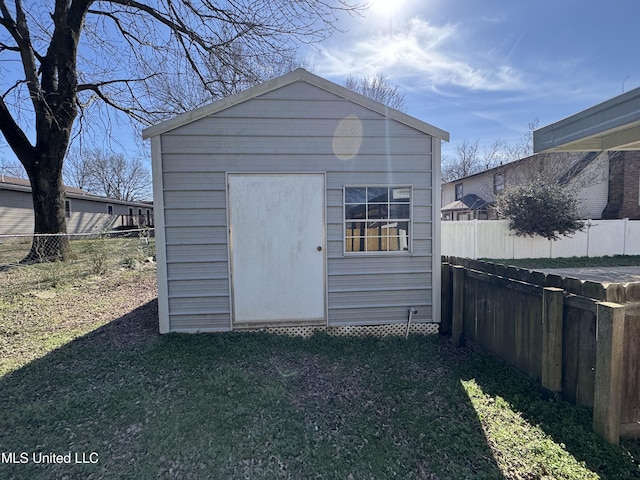 view of shed with a fenced backyard