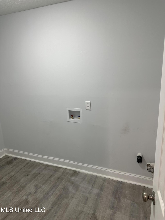 laundry room with hookup for a washing machine and dark hardwood / wood-style flooring