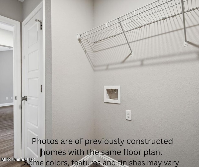 clothes washing area with hardwood / wood-style floors