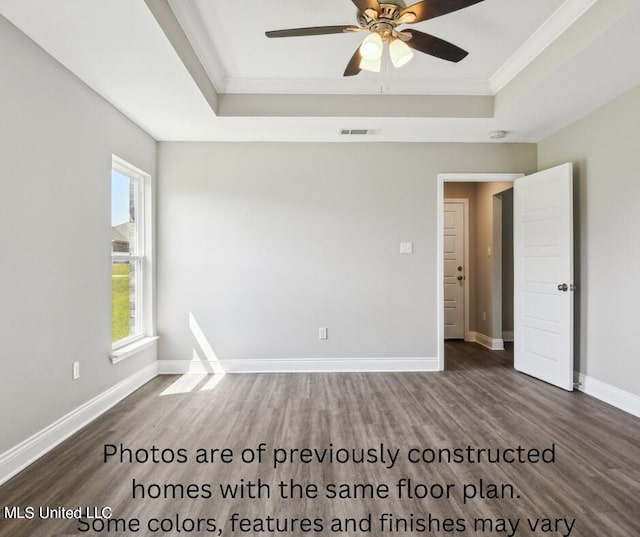 empty room featuring ceiling fan, ornamental molding, and dark hardwood / wood-style floors