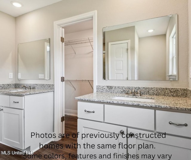 bathroom featuring vanity and hardwood / wood-style floors