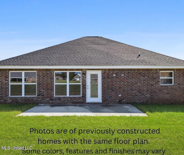 back of house with a patio and a yard