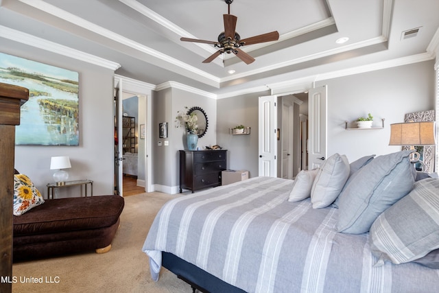 carpeted bedroom with ornamental molding, a raised ceiling, and ceiling fan