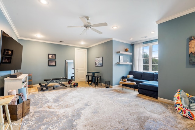 rec room with crown molding, light colored carpet, and ceiling fan