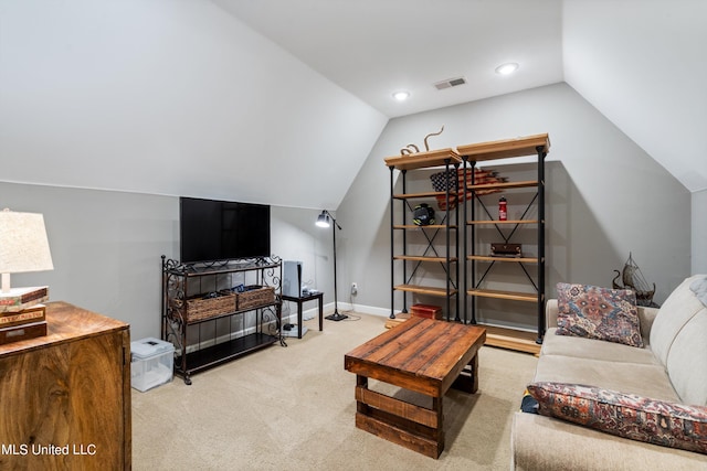 living room featuring lofted ceiling and light colored carpet