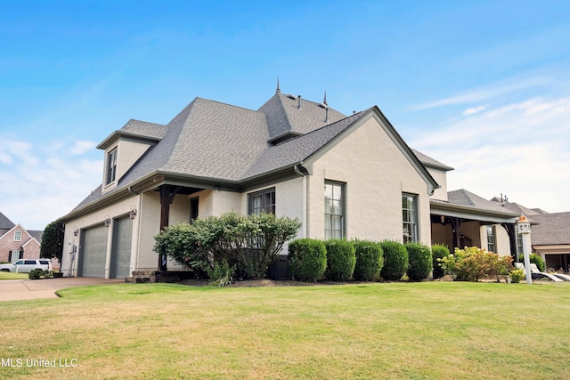 view of property exterior with a garage and a lawn