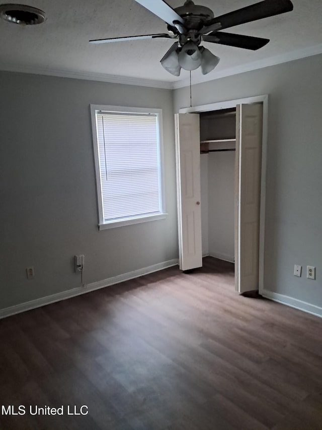 2943 Suncrest Dr, Jackson, MS 39212 - unfurnished bedroom featuring dark wood-style floors, baseboards, ornamental molding, a closet, and ceiling fan