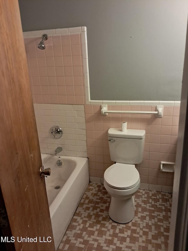 2943 Suncrest Dr, Jackson, MS 39212 - full bathroom with toilet, a wainscoted wall, and tile walls