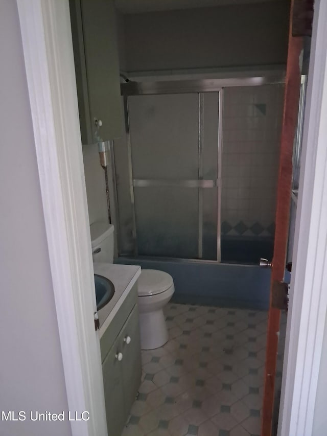 2943 Suncrest Dr, Jackson, MS 39212 - bathroom with toilet, vanity, and combined bath / shower with glass door