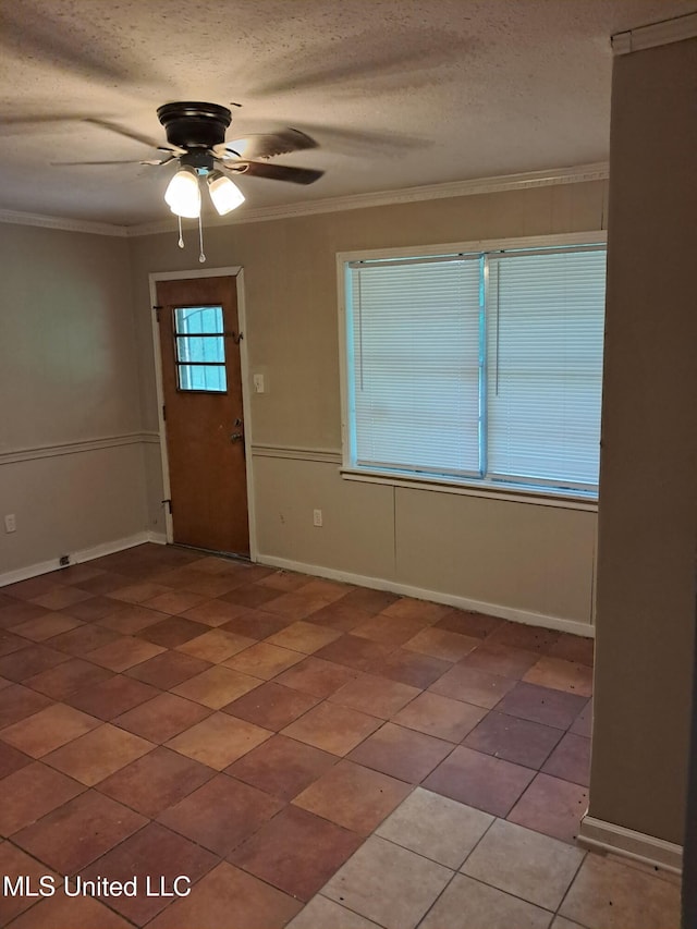 2943 Suncrest Dr, Jackson, MS 39212 - entrance foyer featuring ceiling fan, ornamental molding, light tile patterned floors, a textured ceiling, and baseboards