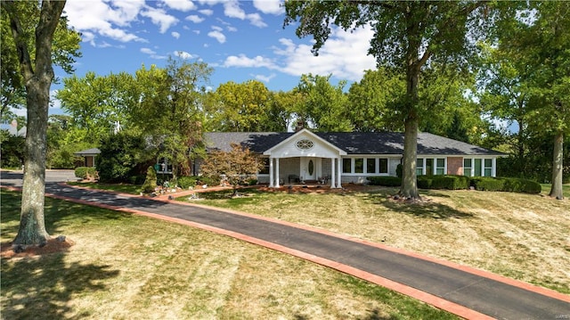 1 Denny Ln, Huntleigh, MO 63131 - ranch-style home featuring a front yard and view of scattered trees
