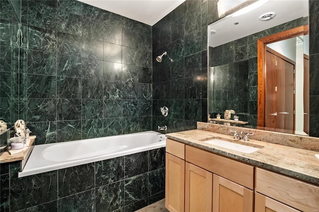 701 N 15th St Unit 504W, Saint Louis, MO 63103 - bathroom with tile walls, tiled shower / bath combo, and vanity