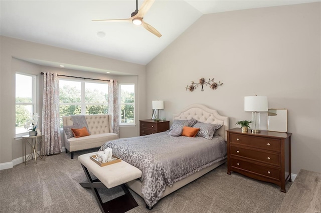 carpeted bedroom featuring baseboards, ceiling fan, and high vaulted ceiling
