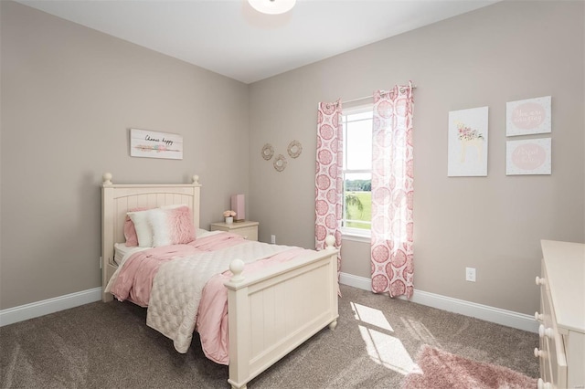 bedroom featuring carpet floors and baseboards