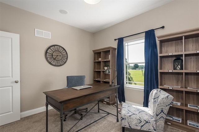 carpeted home office with baseboards